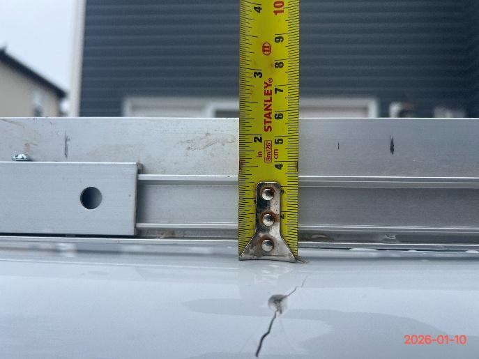 Straightedge measurement confirming top edge deflection