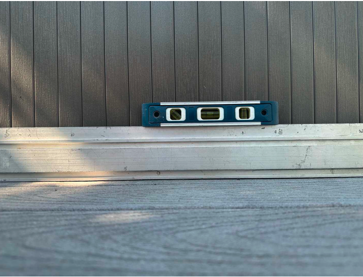 Spirit level confirms deck is perfectly level