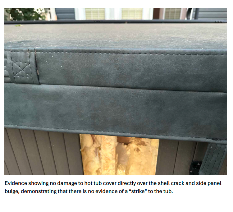 Hot tub cover directly over shell crack showing no damage — no evidence of external strike